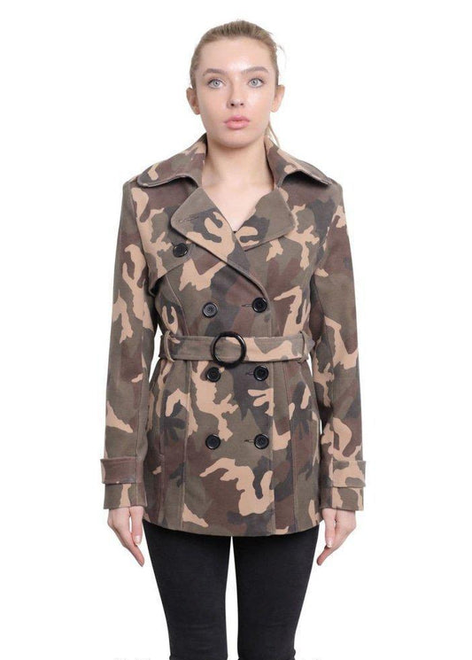 Woman wearing a camouflage coat on a white background