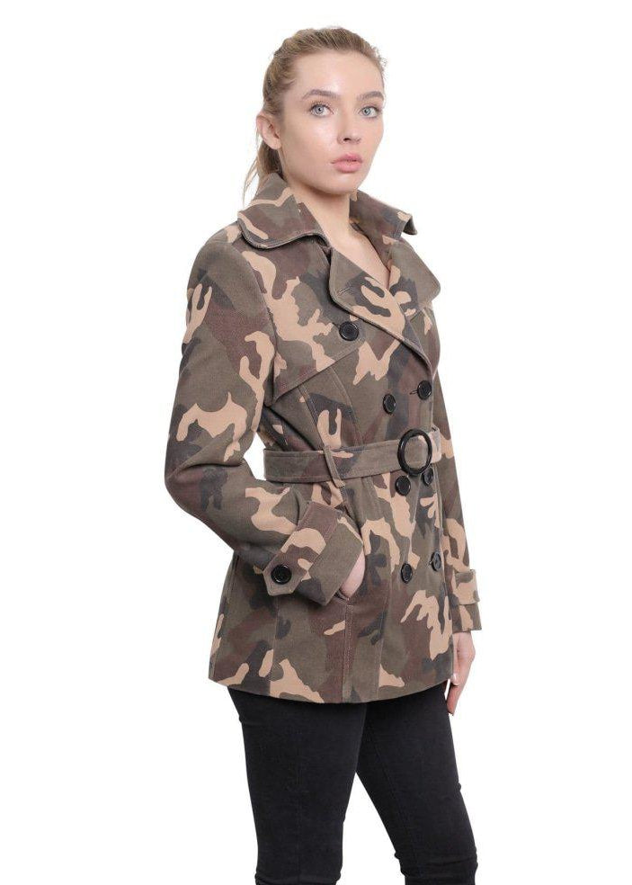 Woman wearing a camouflage coat on a white background
