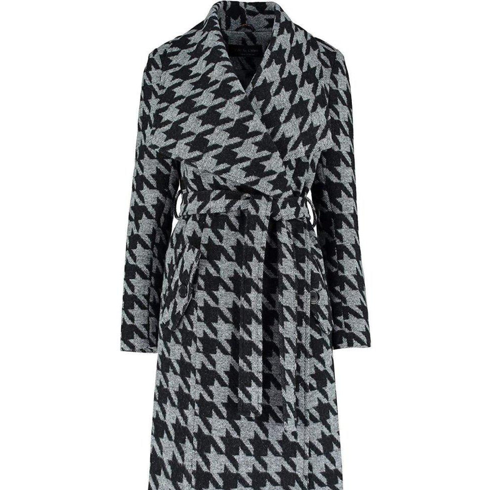 Houndstooth patterned coat on a white background