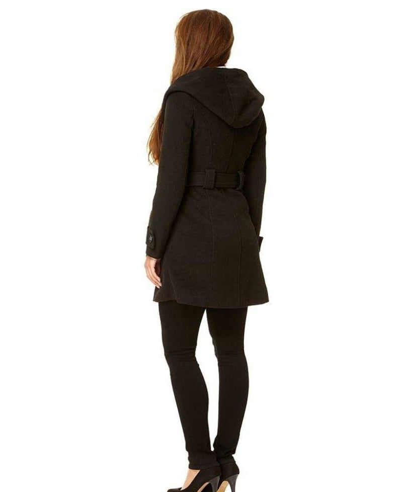 Woman wearing a black coat on a white background.
