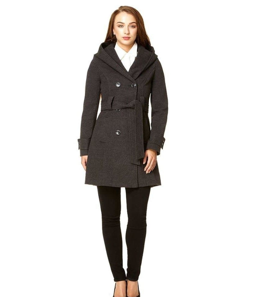 Woman wearing a dark gray coat on a white background.