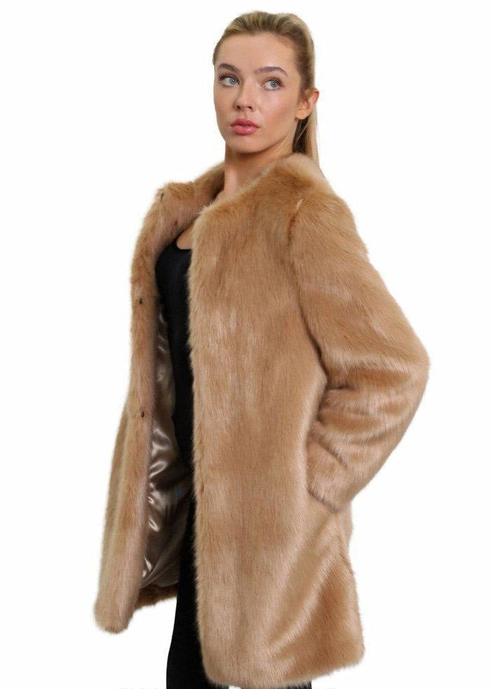 Woman wearing a beige fur coat on a white background
