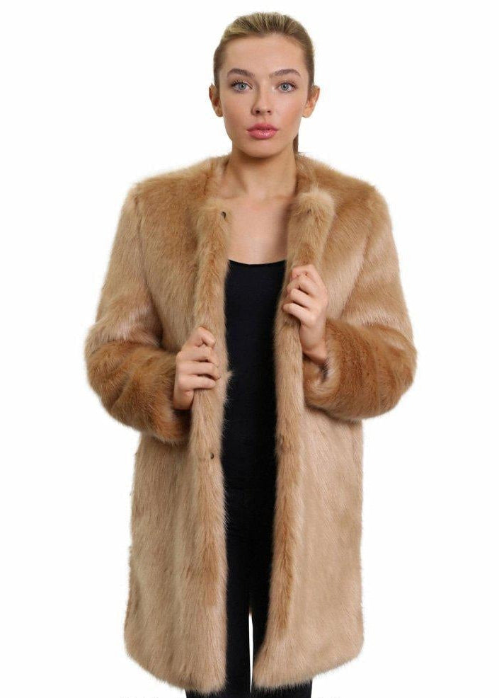Woman wearing a brown fur coat on a white background