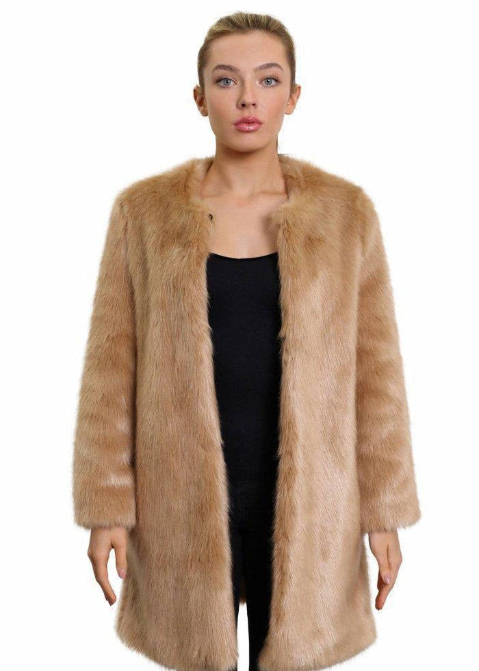Woman wearing a long fur coat on a white background