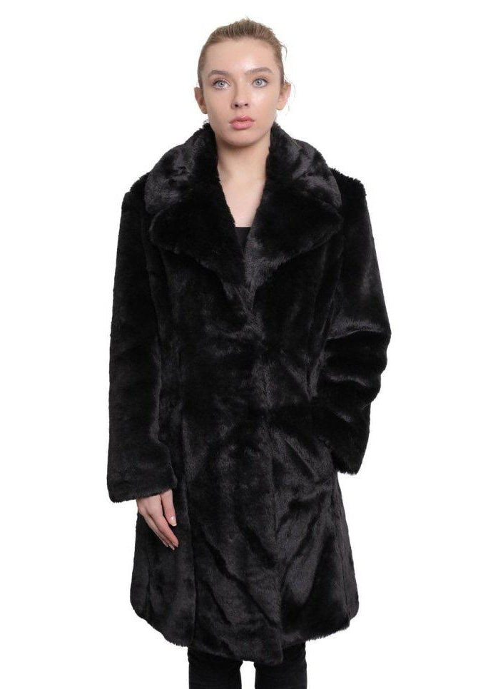 Woman wearing a black fur coat on a white background