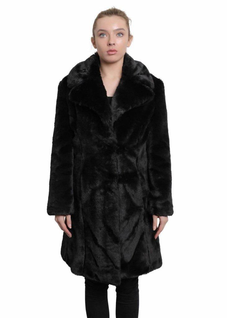 Woman wearing a black fur coat on a white background