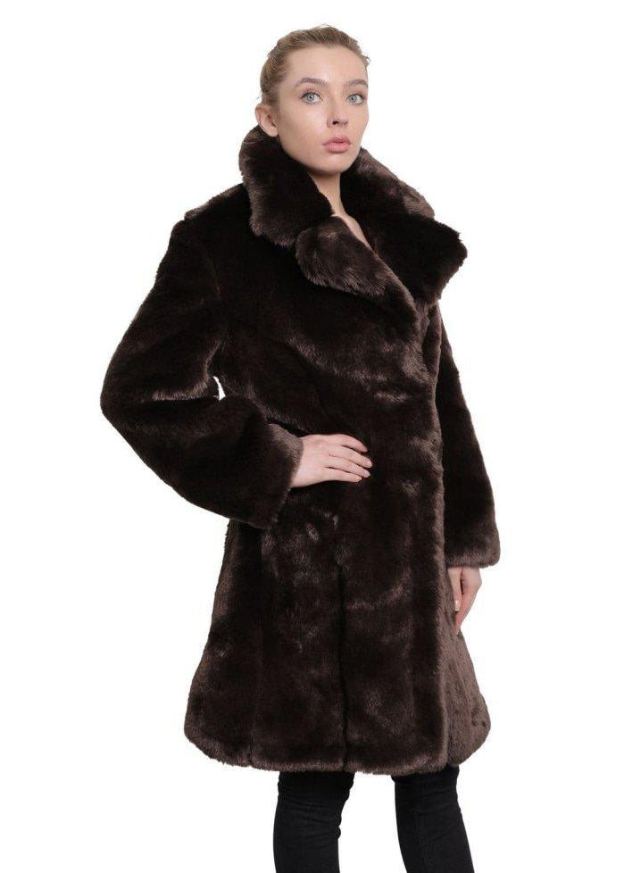 Woman wearing a brown fur coat on a white background