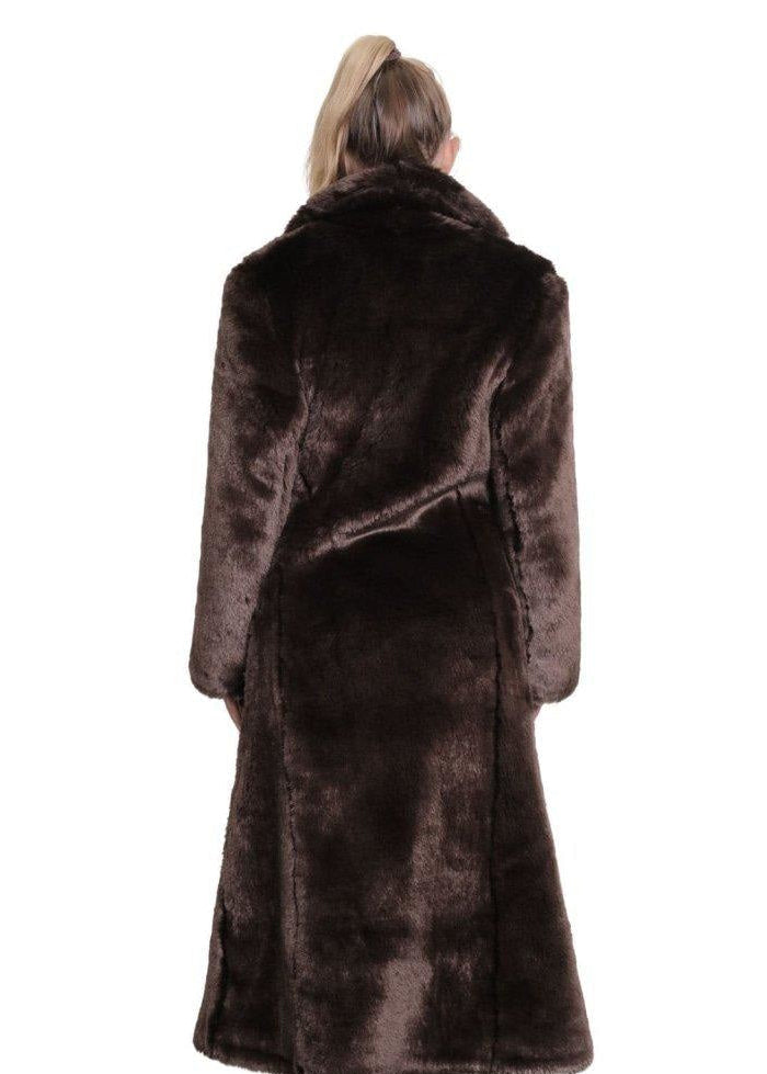 Brown fur coat worn by a person on a white background