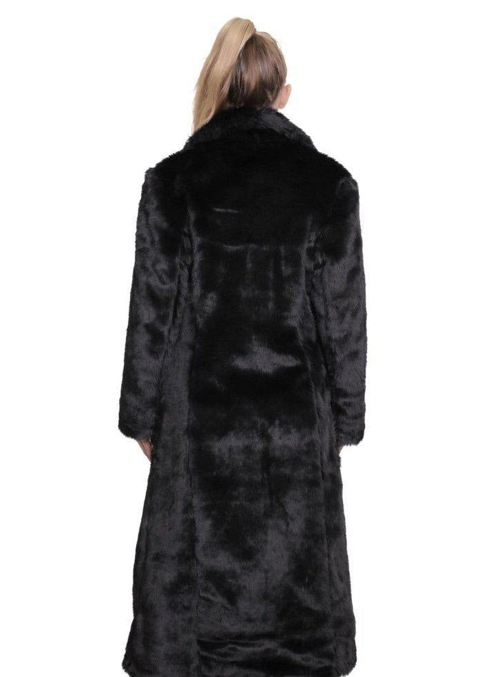 Black fur coat worn by a person on a white background