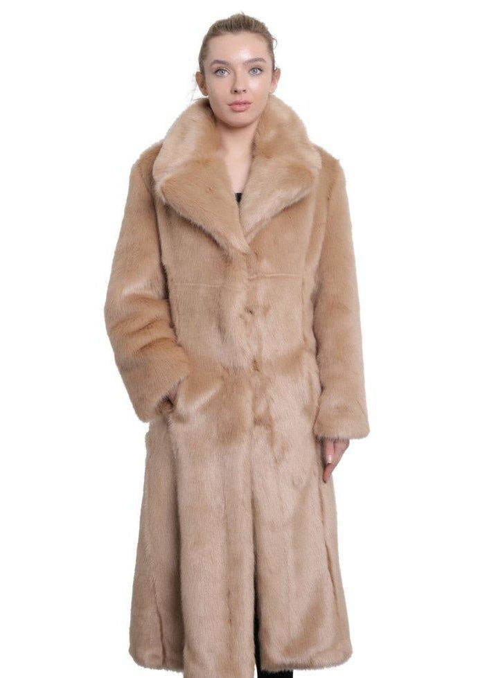 Woman wearing a long beige fur coat on a white background