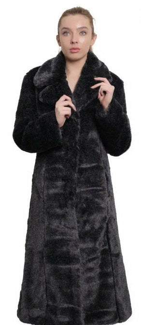 Woman wearing a long dark fur coat