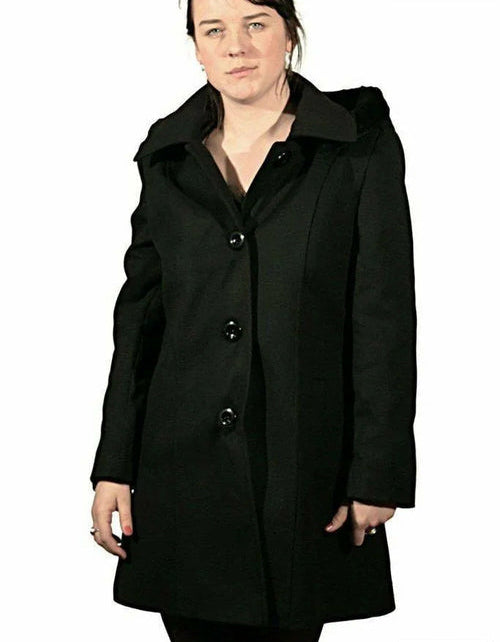 Woman wearing a black coat