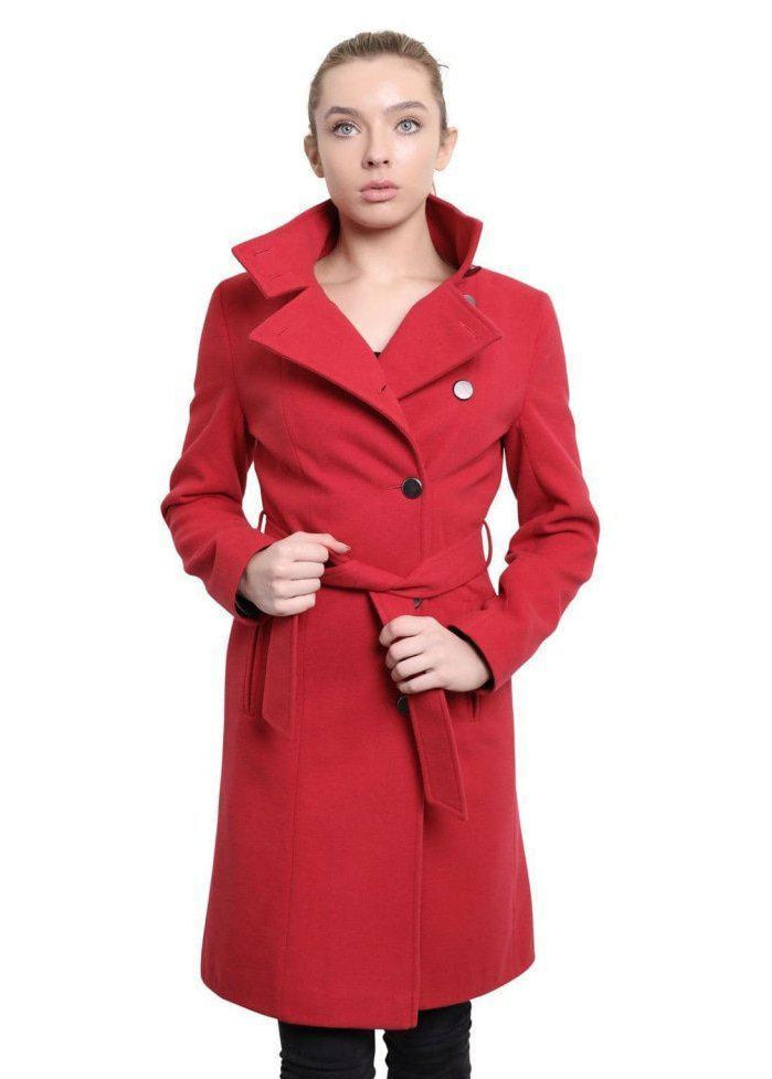 Woman wearing a red coat with a white background