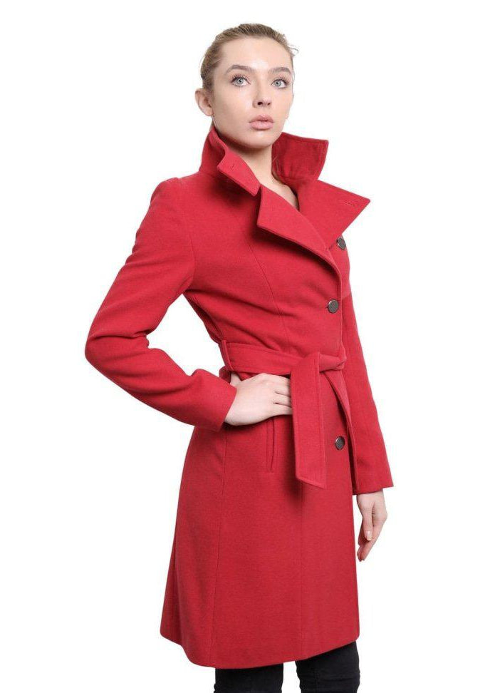 Woman wearing a red coat on a white background