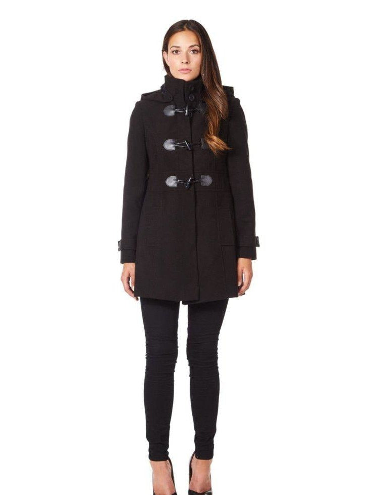 Woman wearing a black coat on a white background.