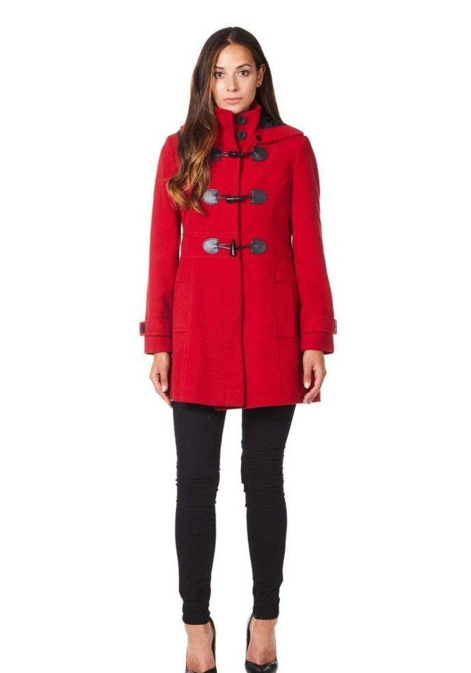 Woman wearing a red coat with black buttons on a white background.