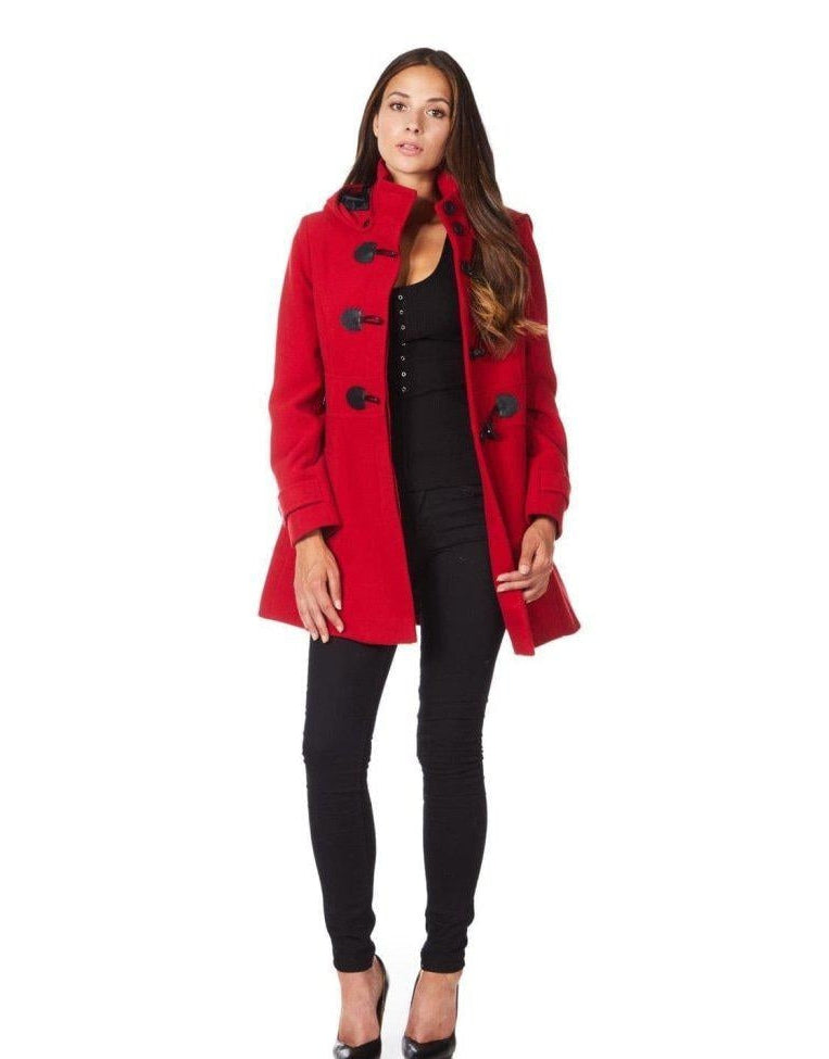 Woman wearing a red coat with black buttons on a white background.