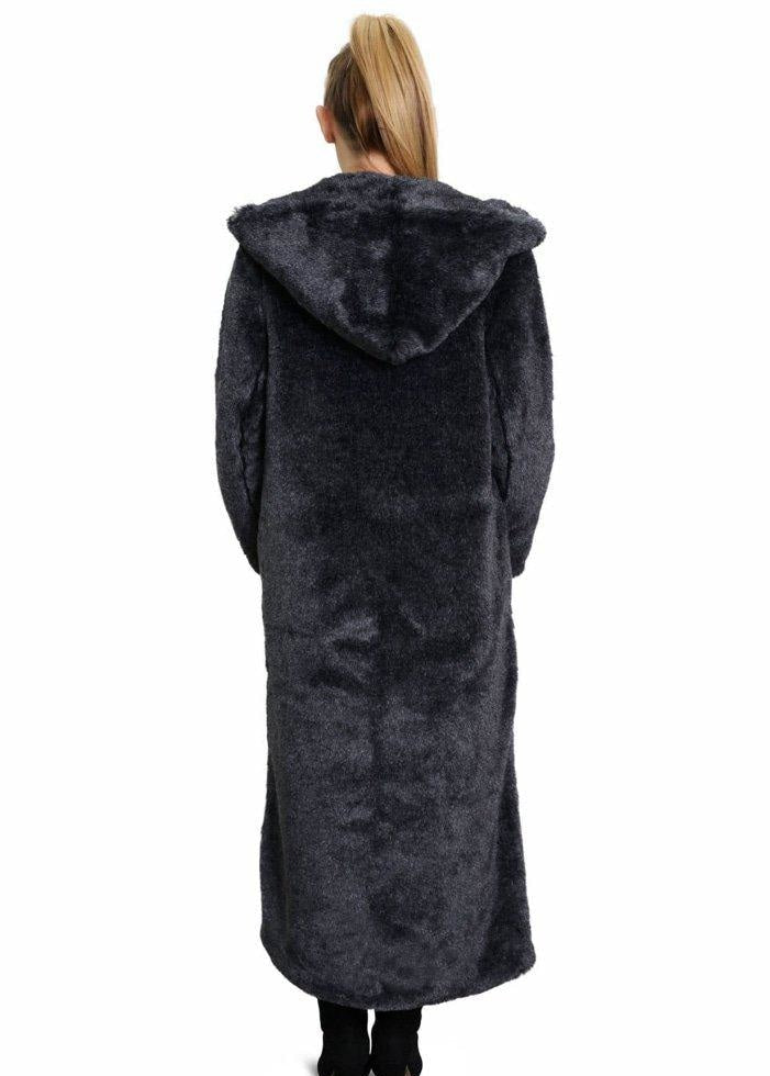 Person wearing a long dark coat with a hood on a white background