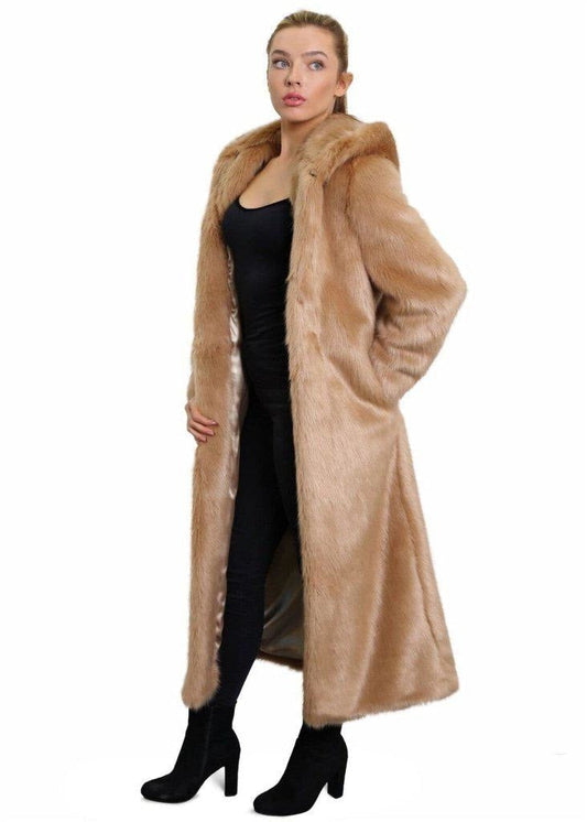 Woman wearing a long beige fur coat on a white background