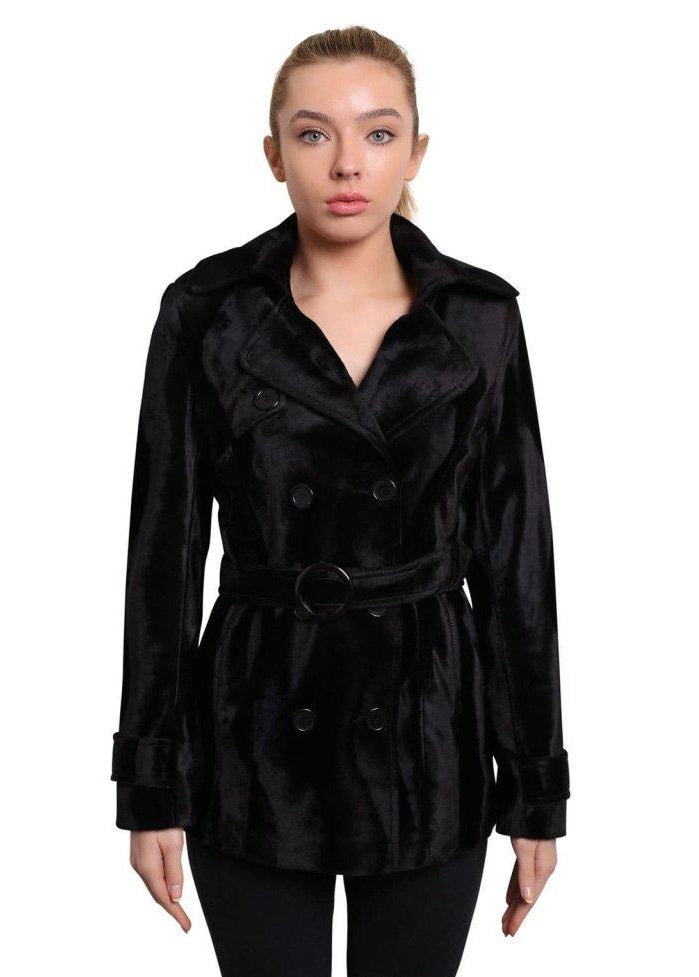 Woman wearing a black coat on a white background