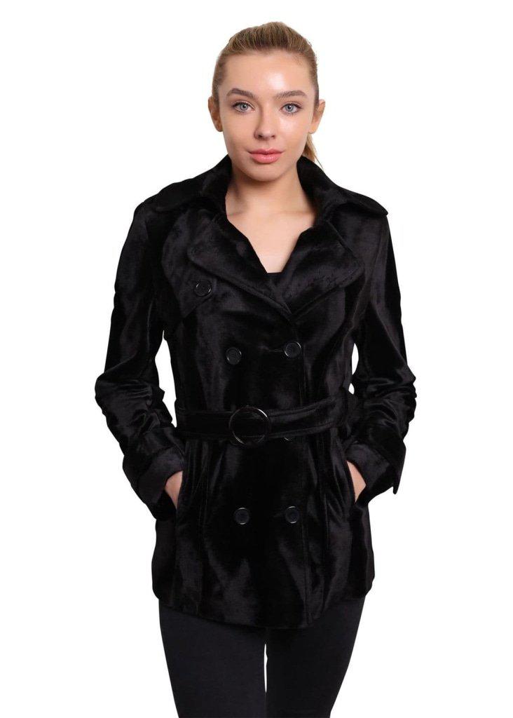Woman wearing a black coat on a white background