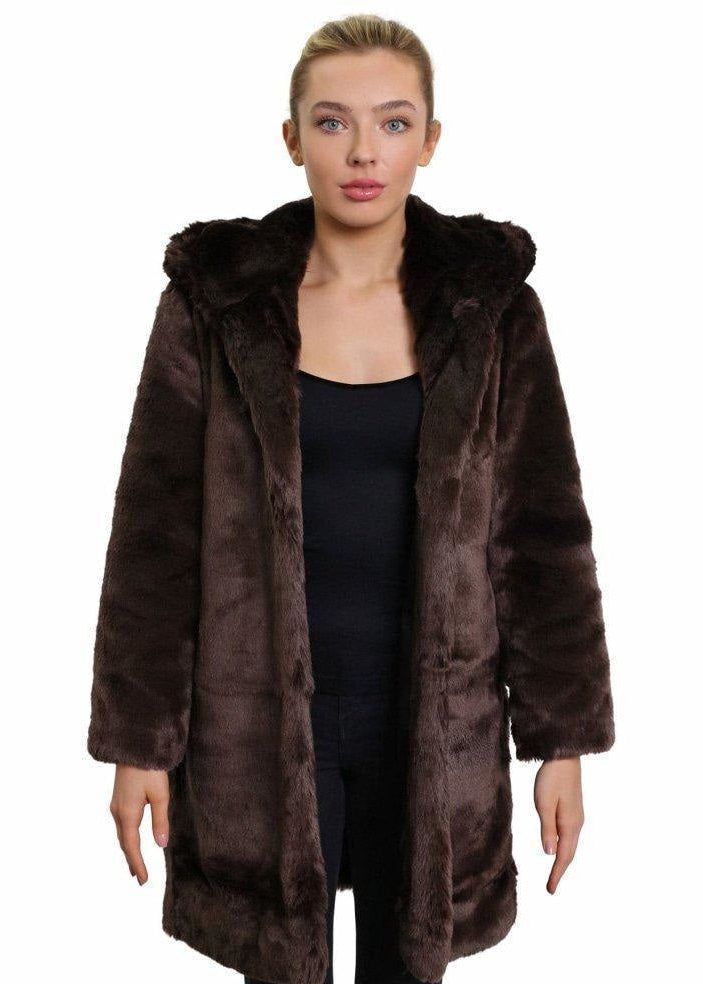 Woman wearing a brown fur coat on a white background