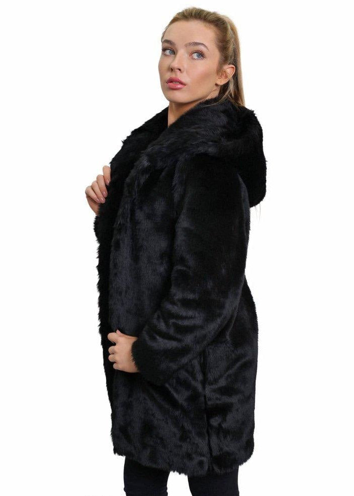 Woman wearing a black fur coat on a white background