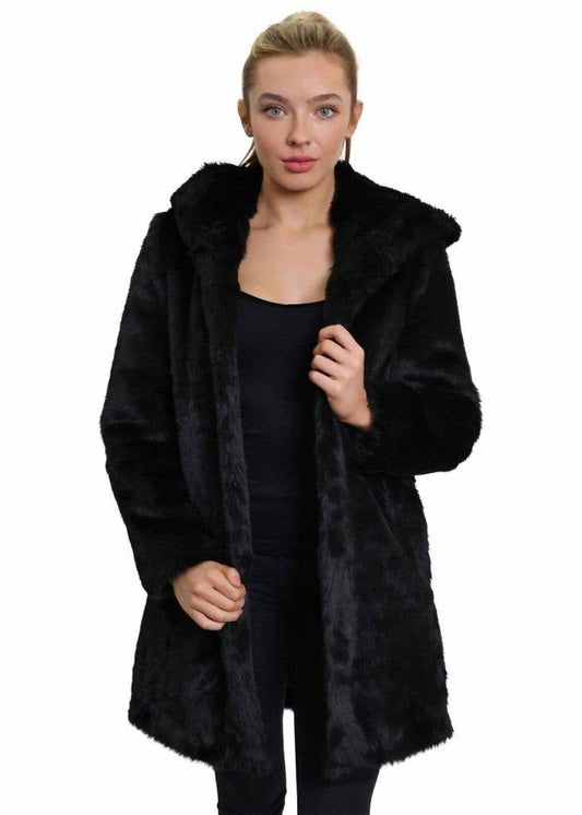 Woman wearing a black fur coat on a white background