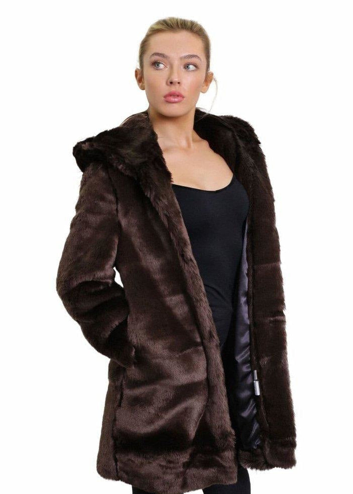 Woman wearing a brown fur coat on a white background