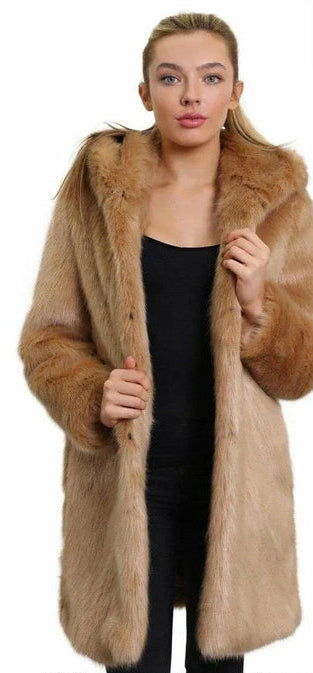 Woman wearing a long fur coat on a white background