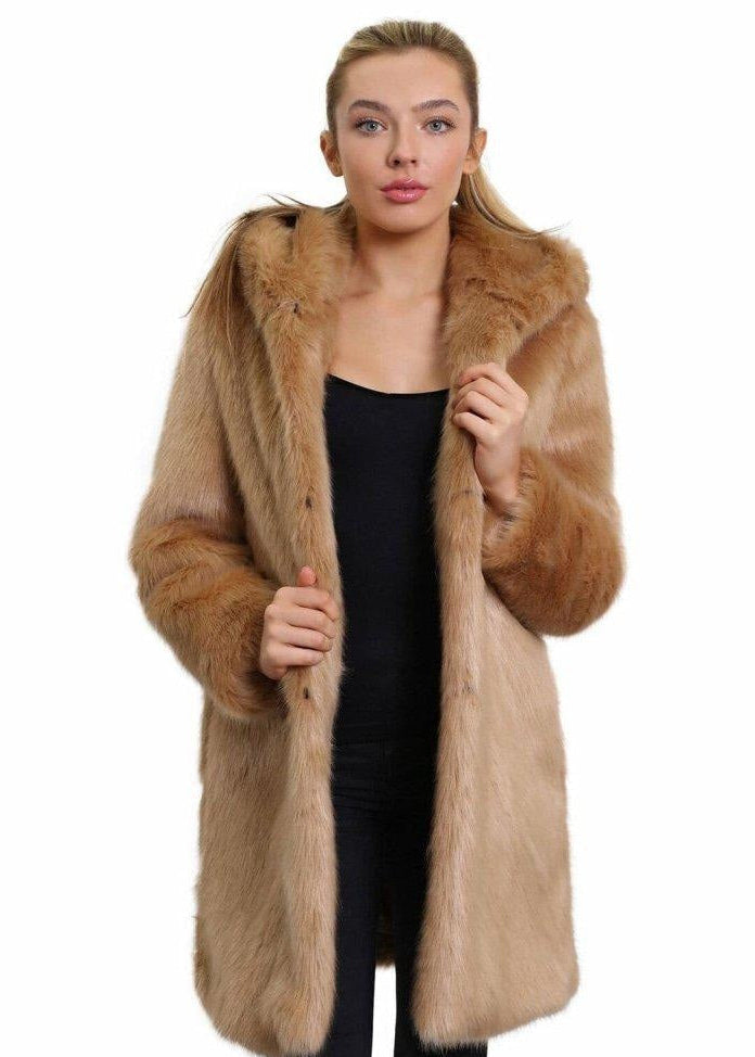 Woman wearing a long brown fur coat on a white background