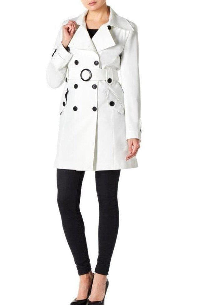 White coat with black polka dots worn by a model on a white background