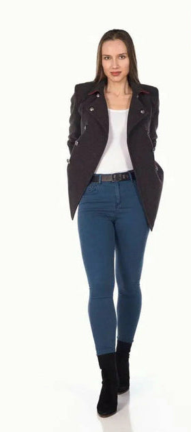 Woman wearing a black jacket, white shirt, and blue jeans on a white background