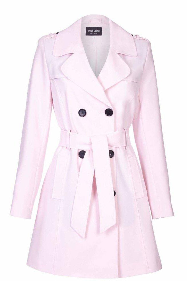 Pink trench coat with black buttons on a white background