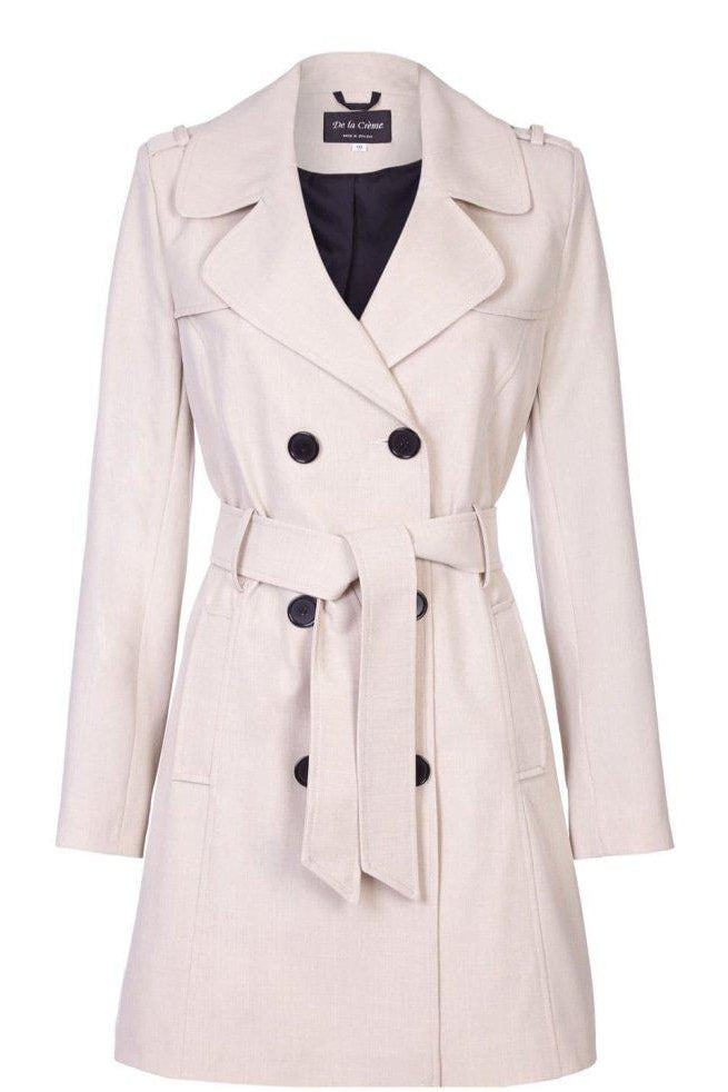 Beige trench coat with black buttons on a white background