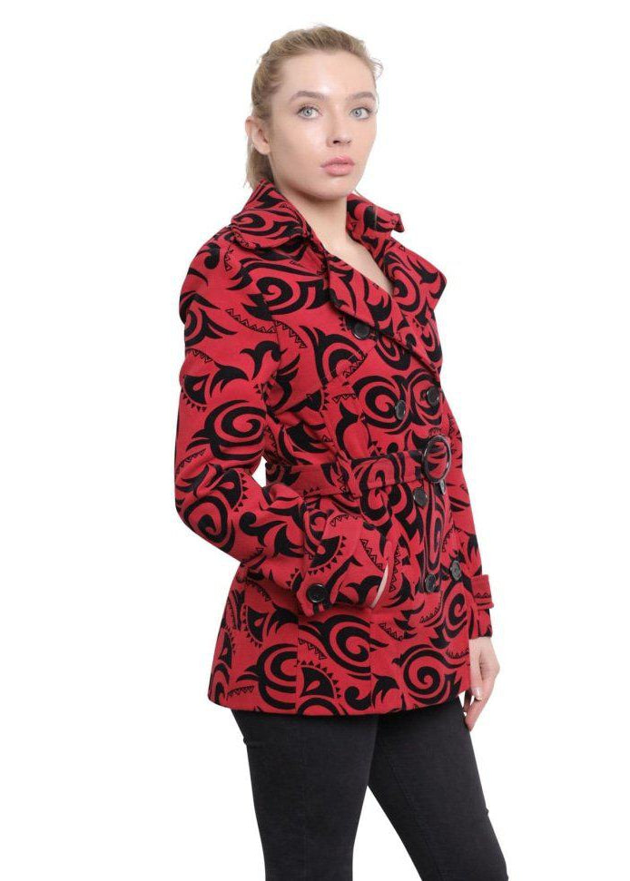 Woman wearing a red and black patterned coat on a white background