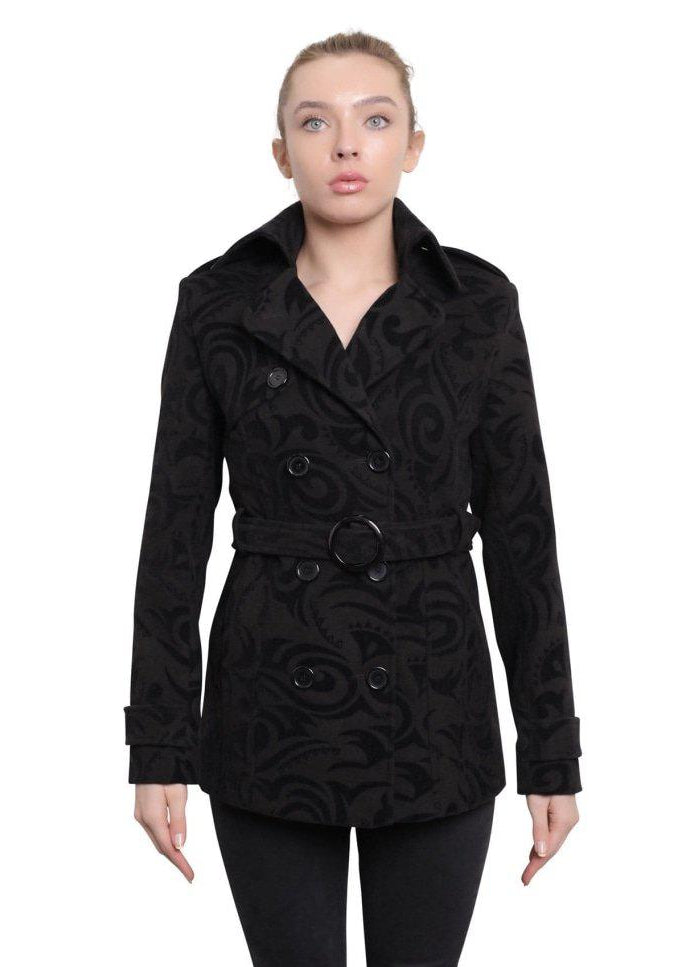 Woman wearing a black textured coat with a white background