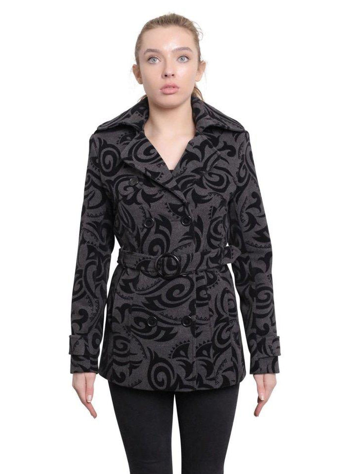 Woman wearing a black patterned coat on a white background