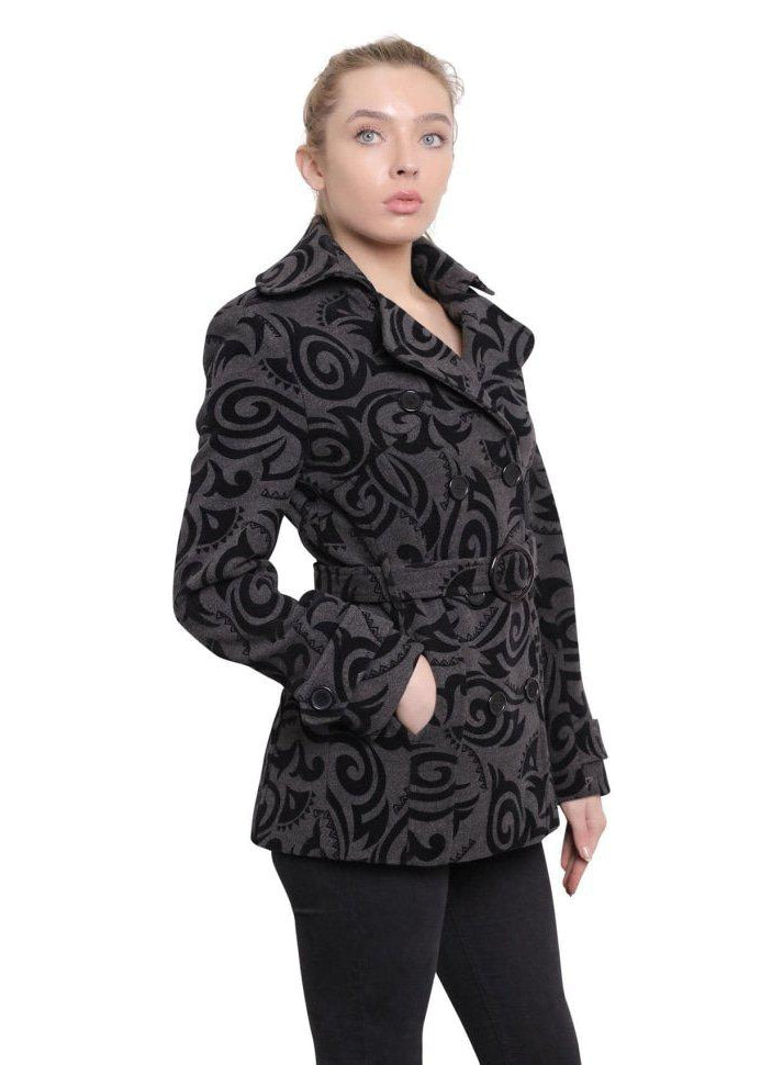 Woman wearing a black patterned coat on a white background