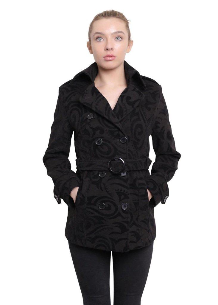 Woman wearing a black patterned coat on a white background