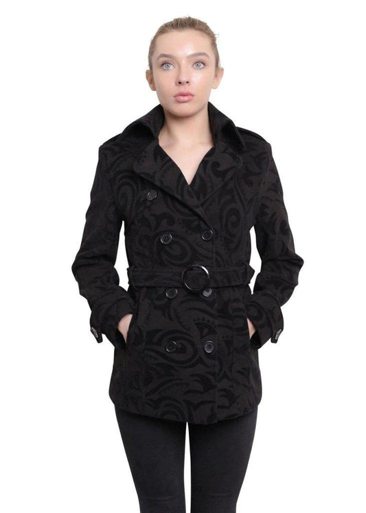 Woman wearing a black patterned coat on a white background
