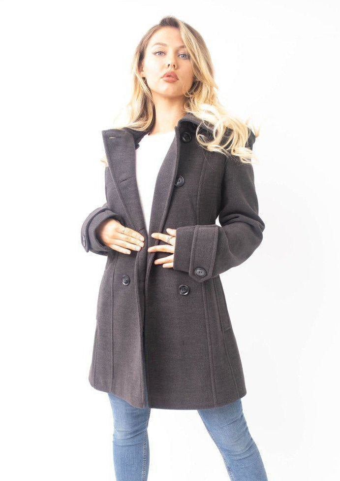 Woman wearing a gray coat on a white background