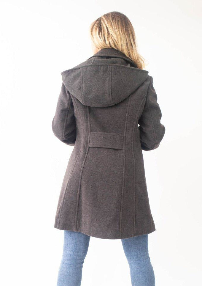 Person wearing a brown hooded coat on a white background