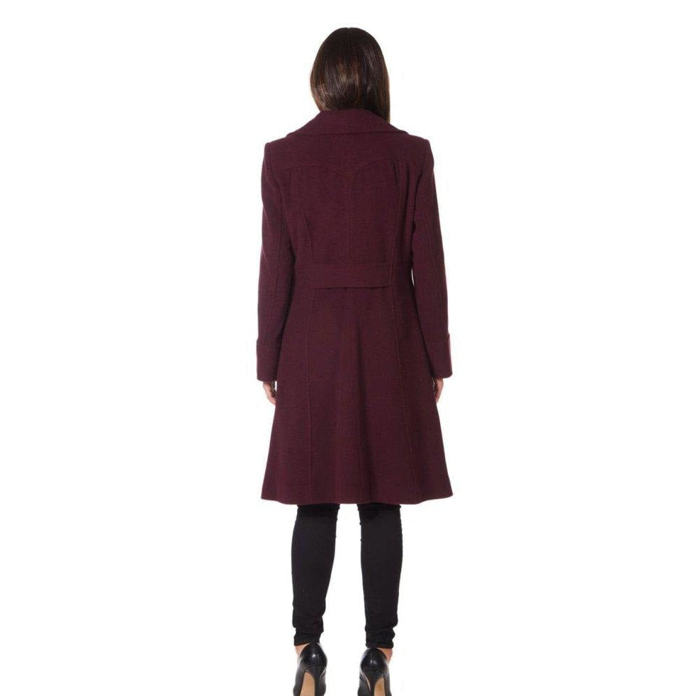 Person wearing a burgundy coat on a white background