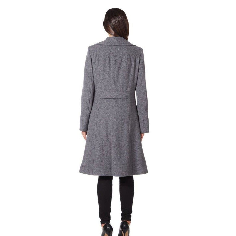 Person wearing a gray coat on a white background