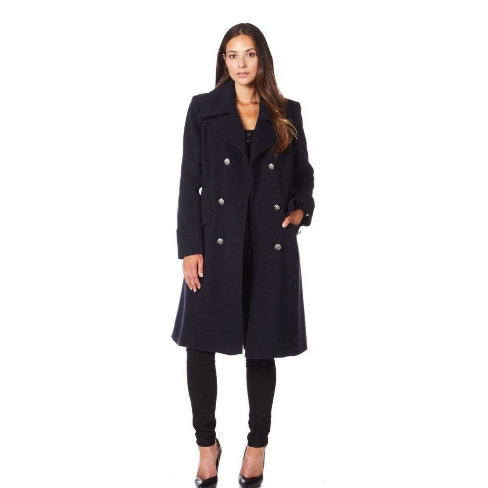 Woman wearing a navy blue coat on a white background