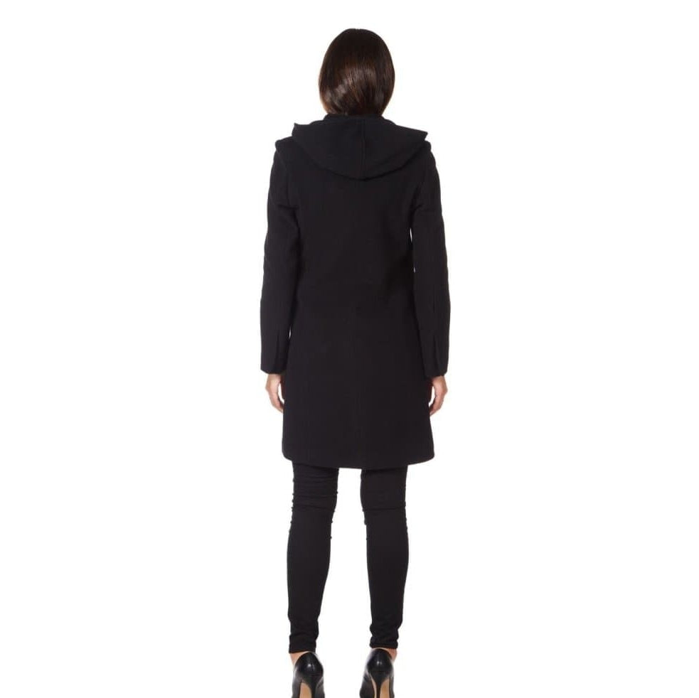 Person wearing a black coat on a white background