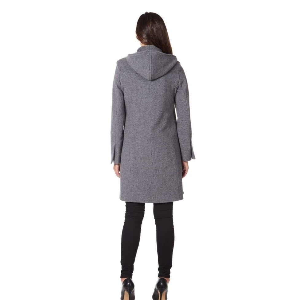 Woman wearing a gray coat on a white background