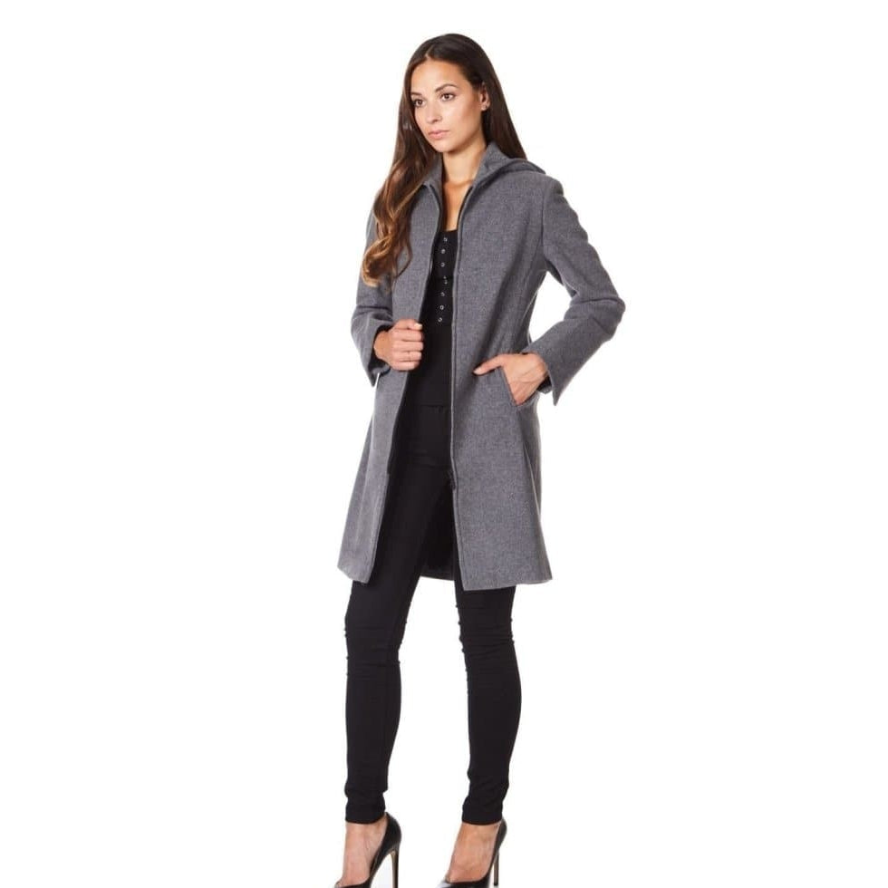 Woman wearing a gray coat on a white background