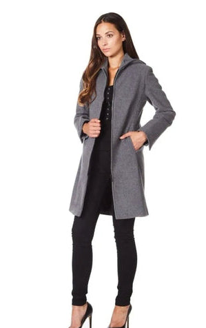 Woman wearing a gray coat with a white background